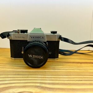Yashica Black and Silver Film Camera with Rangefinder Design